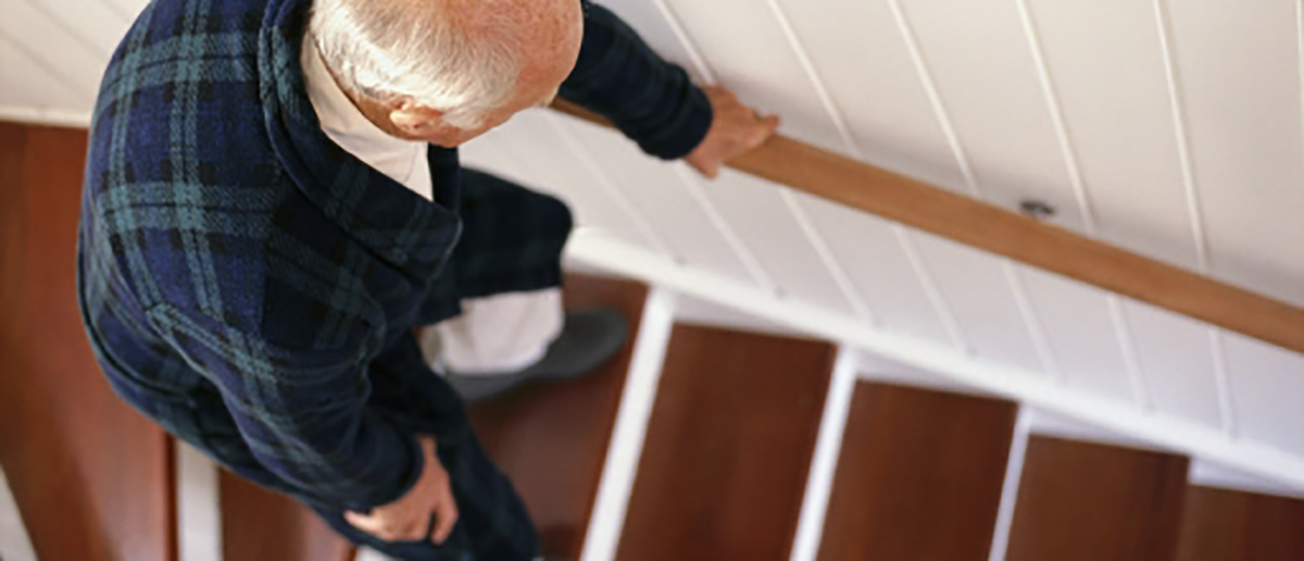 Old man going down stairs